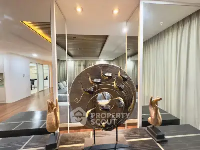 Luxurious living room with elegant decor and mirrored walls