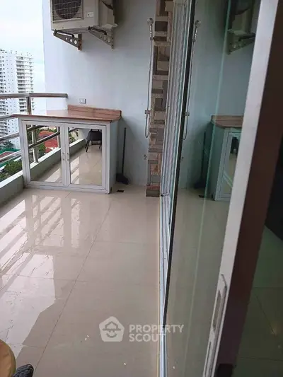 Spacious balcony with city view, perfect for relaxation and enjoying the skyline.