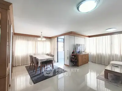 Spacious living room with elegant dining area and modern decor