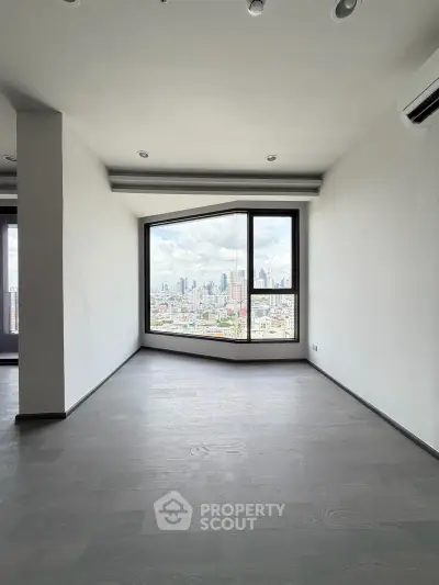 Spacious modern living room with stunning city view through large window