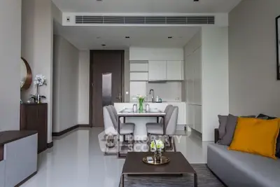 Modern living room with dining area, sleek furniture, and minimalist decor in a stylish apartment.