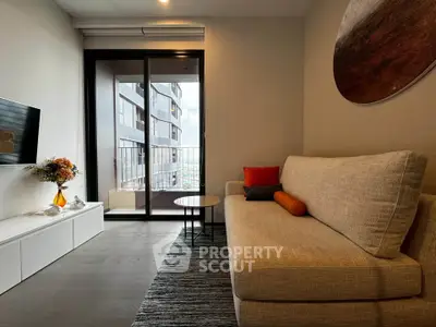 Modern living room with cozy sofa and balcony view in urban apartment