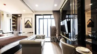 Luxurious modern bedroom with elegant decor and balcony access