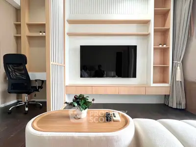 Modern living room with sleek TV setup and stylish wooden shelves, perfect for contemporary living.