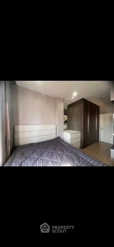 Modern bedroom with sleek design and ample natural light
