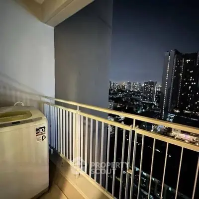 Stunning city view from high-rise balcony with washing machine.