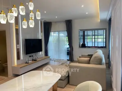 Luxurious modern living room with elegant lighting and cozy seating area