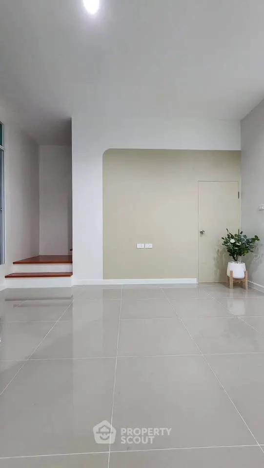 Spacious modern interior with sleek tile flooring and minimalist design