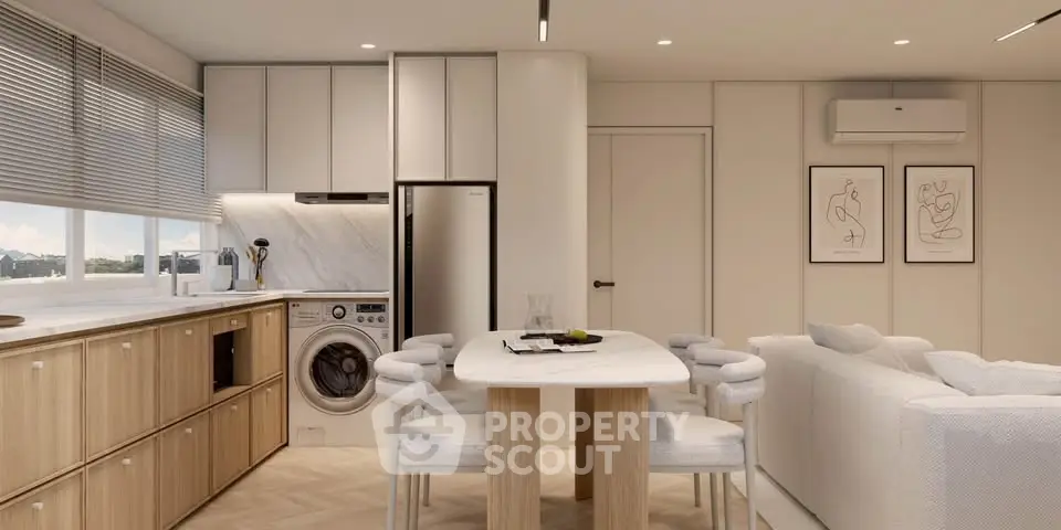 Modern open-plan kitchen and living area with stylish furniture and appliances.