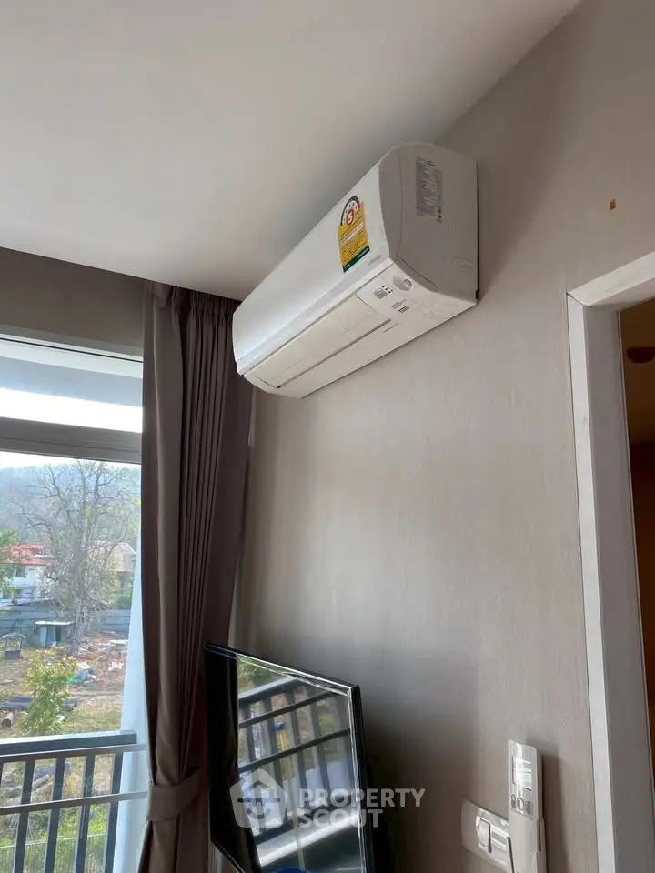 Modern apartment with air conditioning and large window view