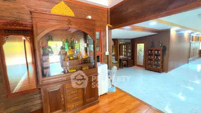Spacious living area with elegant wooden decor and ample natural light