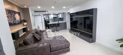 Modern living room with sleek design and open kitchen layout