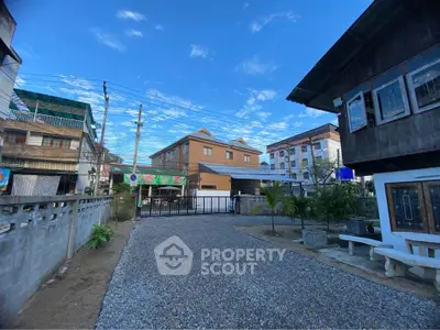 Charming residential area with traditional and modern houses under a clear blue sky.