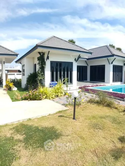 Charming modern villa with pool and lush garden, perfect for luxury living.