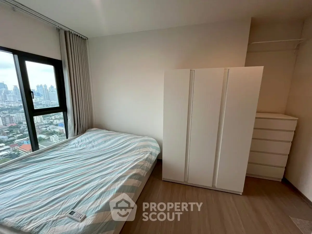Cozy bedroom with city view and modern furnishings