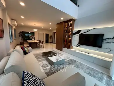 Luxurious modern living room with elegant decor and open kitchen layout