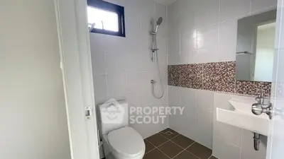 Modern bathroom with sleek shower and stylish tile accents