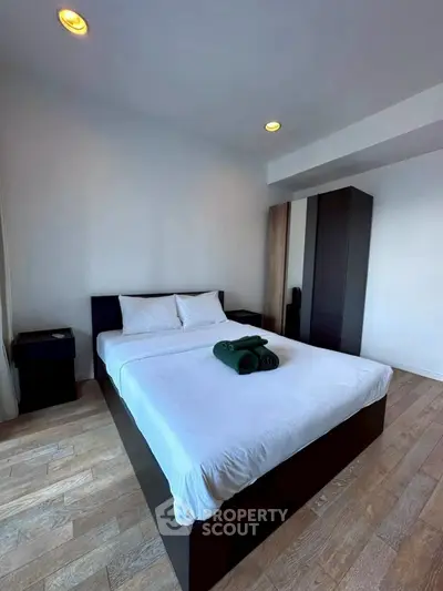 Modern bedroom with sleek furniture and cozy ambiance, perfect for relaxation and comfort.