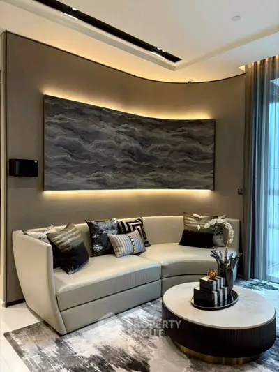 Luxurious modern living room with elegant sofa, stylish decor, and ambient lighting, perfect for sophisticated living.