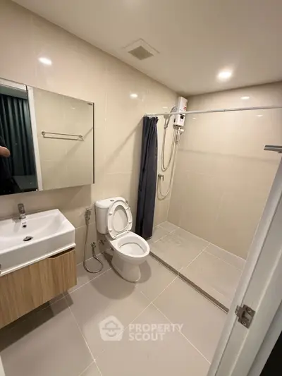 Modern bathroom with sleek fixtures and spacious shower area