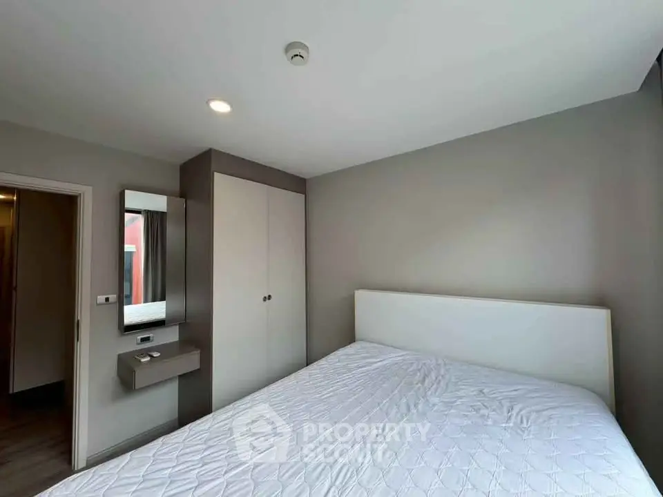 Modern bedroom with minimalist design and ample natural light