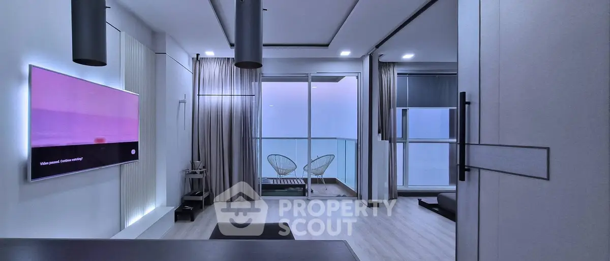 Modern living room with balcony and sleek interior design