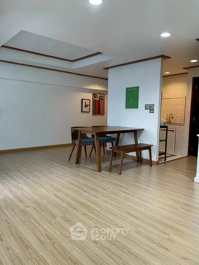 Modern dining area with wooden flooring and stylish furniture