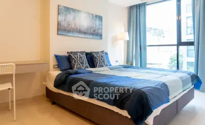 Modern bedroom with large window and stylish decor
