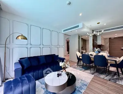 Luxurious modern living room with elegant blue sofa and stylish dining area