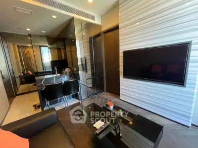 Modern living room with sleek design, featuring a wall-mounted TV and stylish dining area.