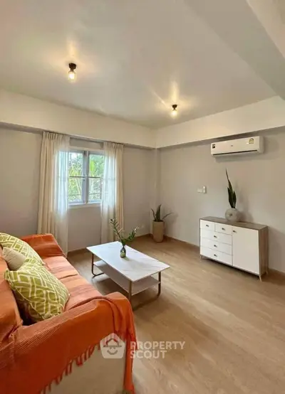 Bright and cozy living room with modern decor and air conditioning