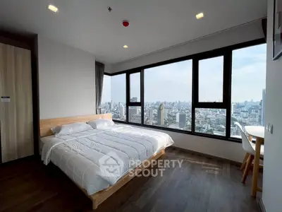 Stunning bedroom with panoramic city view and modern furnishings