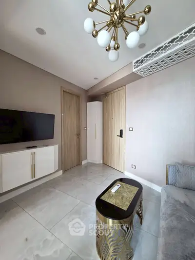 Modern living room with elegant chandelier and sleek furniture design