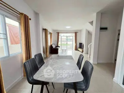 Spacious modern living room with elegant dining area and natural light