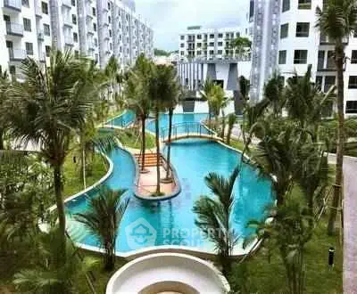 Luxurious apartment complex with stunning pool and lush landscaping