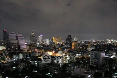 Stunning city skyline view at night with illuminated buildings and vibrant urban landscape.