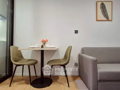 Modern living room with stylish dining area and cozy sofa, perfect for urban living.