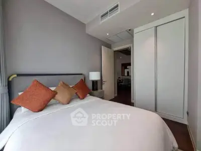 Modern bedroom with cozy bed and stylish decor in a contemporary apartment.