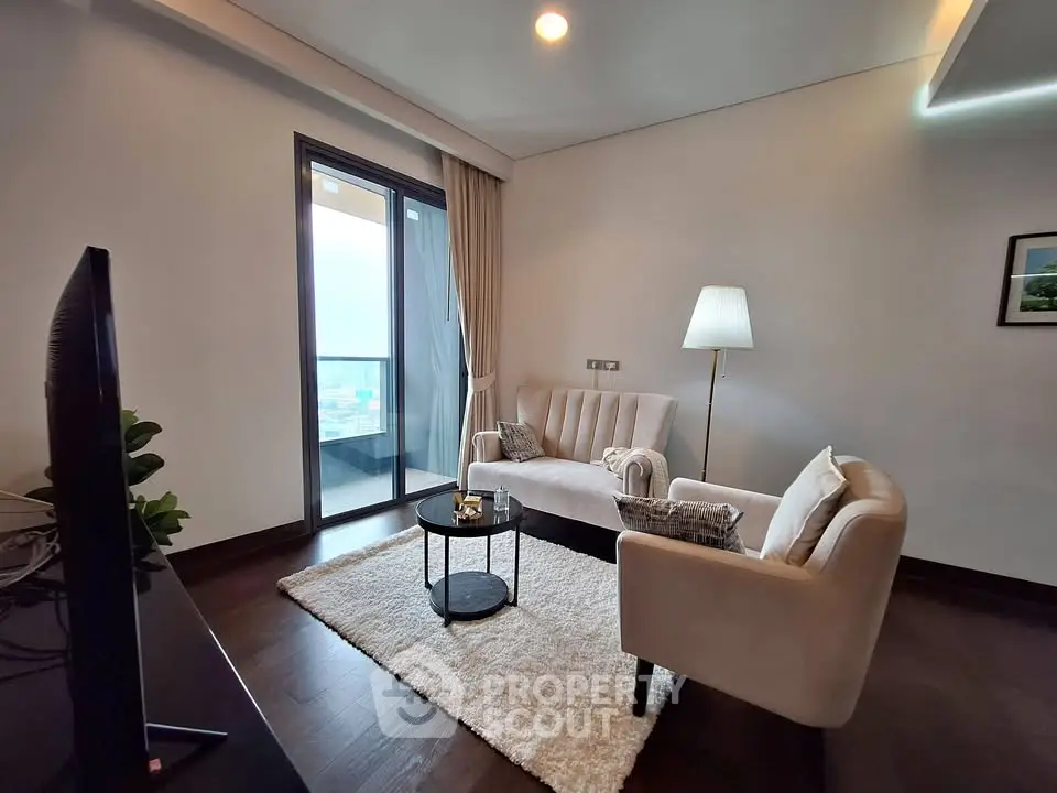 Modern living room with elegant decor and balcony view