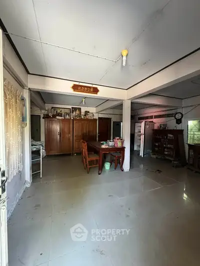 Spacious living room with traditional decor and ample natural light