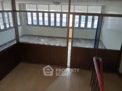 Spacious office space with large windows and natural light