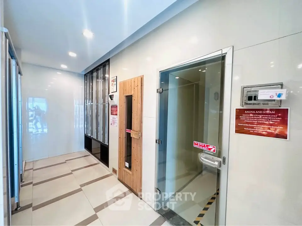 Modern sauna and steam room in a luxury residential building with sleek design.