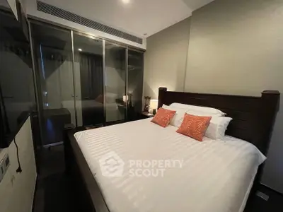 Luxurious bedroom with elegant wooden bed and modern glass wardrobe
