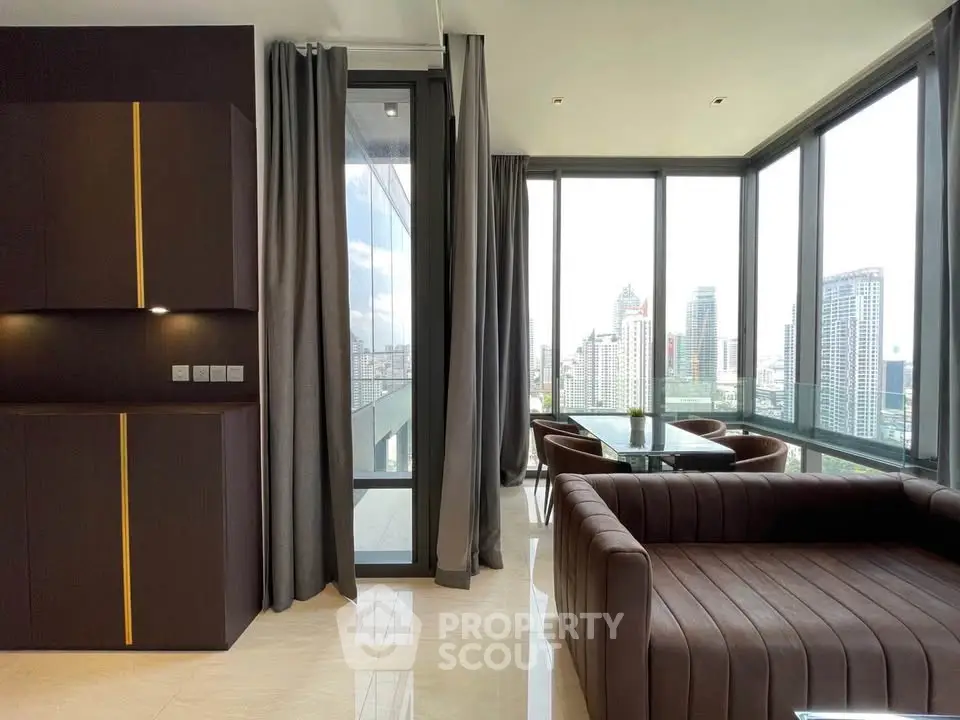 Luxurious modern living room with panoramic city views and elegant furnishings.