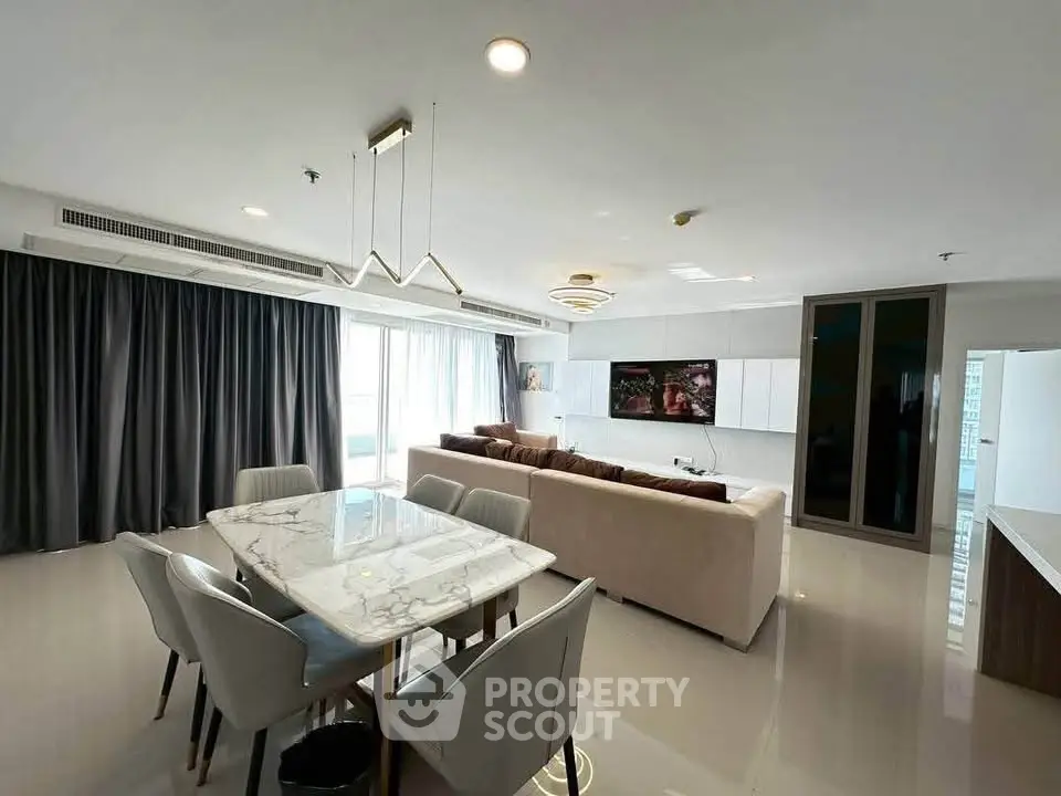 Spacious modern living room with elegant furniture and large windows