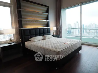 Luxurious bedroom with city view and elegant decor in modern apartment