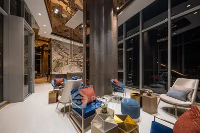 Luxurious modern living room with floor-to-ceiling windows and elegant decor in a high-rise building.