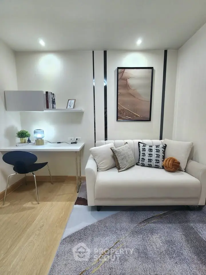 Modern living room with stylish decor and cozy seating area, perfect for relaxation and productivity.