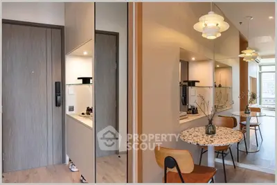 Modern apartment interior with stylish dining area and large mirror reflecting natural light.