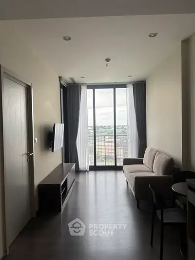 Modern living room with balcony view and sleek furniture